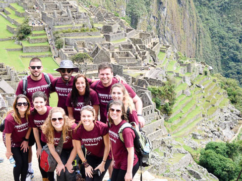 Students pose at Machu Picchu on Chuck Herman's program to Peru