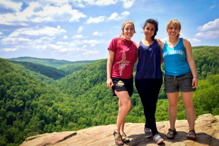 Three students hiking in the Ozarks